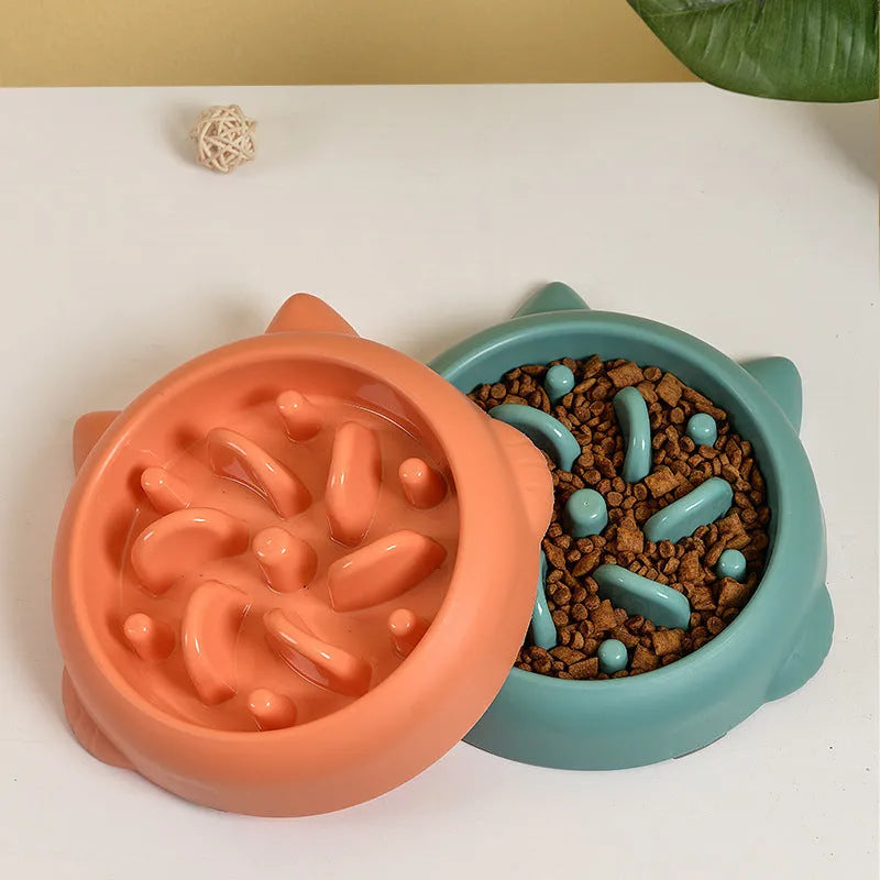 Green bone-shaped slow feeder dog bowl with internal ridges for anti-gulping feeding.