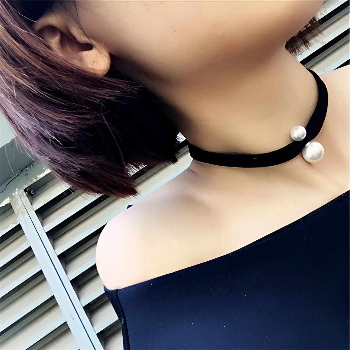 Black hand-woven yarn necklace with simple cute college style on display
