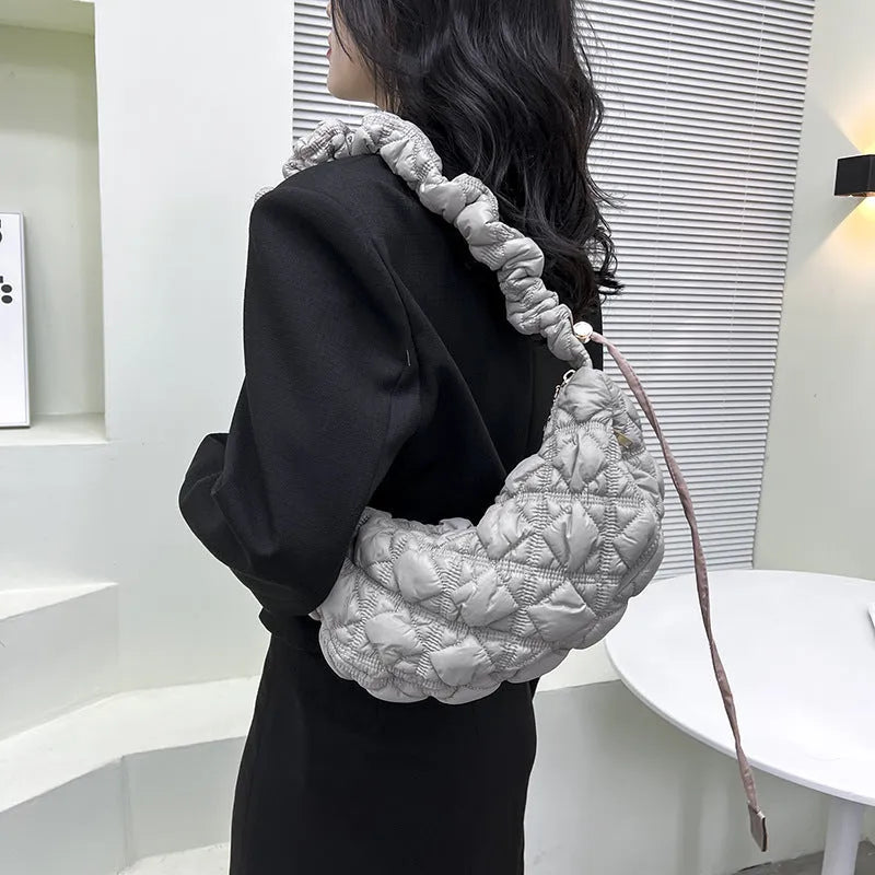 Women's simple nylon cloud underarm messenger bag in a solid colour with an adjustable shoulder strap.