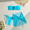 Women's pink tube top swimsuit with large 3D flower tie, matching pants and skirt.