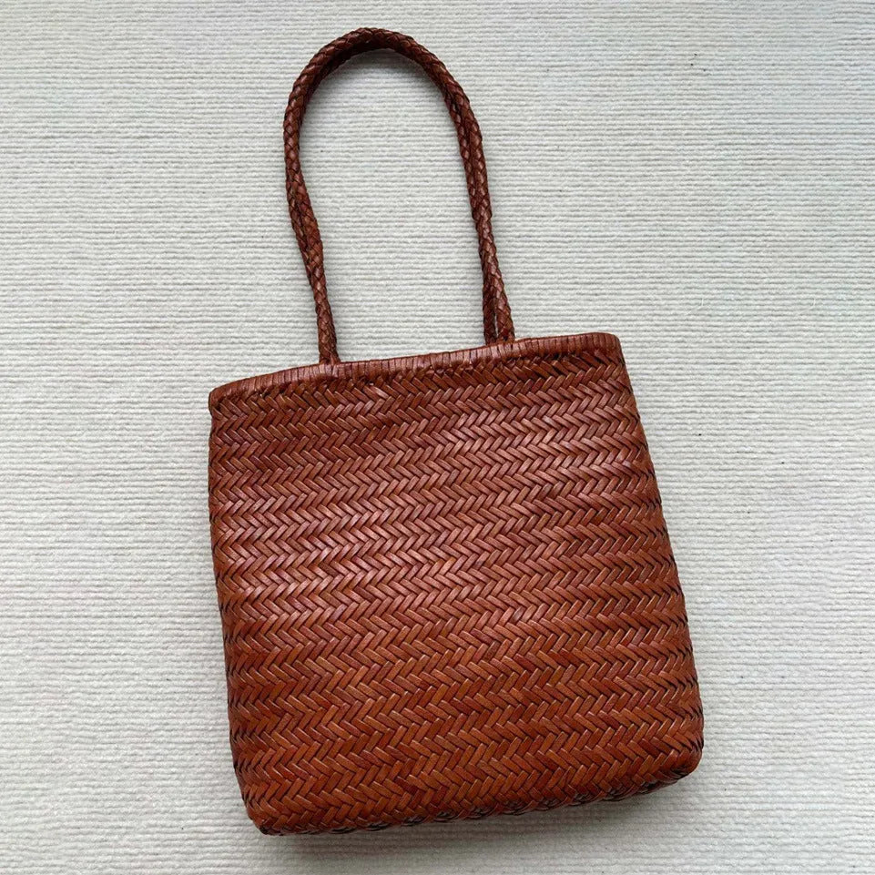 Handmade woven brown leather tote bag with three-dimensional pockets and vintage finish