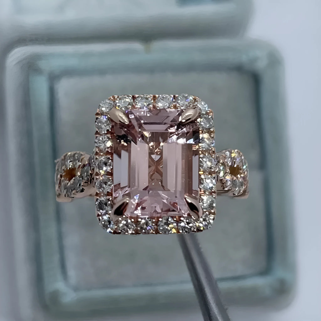 Rose gold geometric alloy ring on a plain background, showing its electroplated finish.