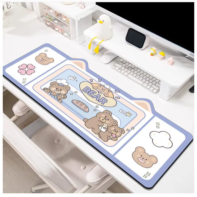 Oversized solid colour desk pad with optional pink bunny, purple bear, or purple kitten patterns on natural rubber base.