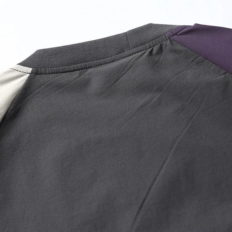 Dark grey men's loose fit t-shirt with contrasting colour raglan short sleeves.