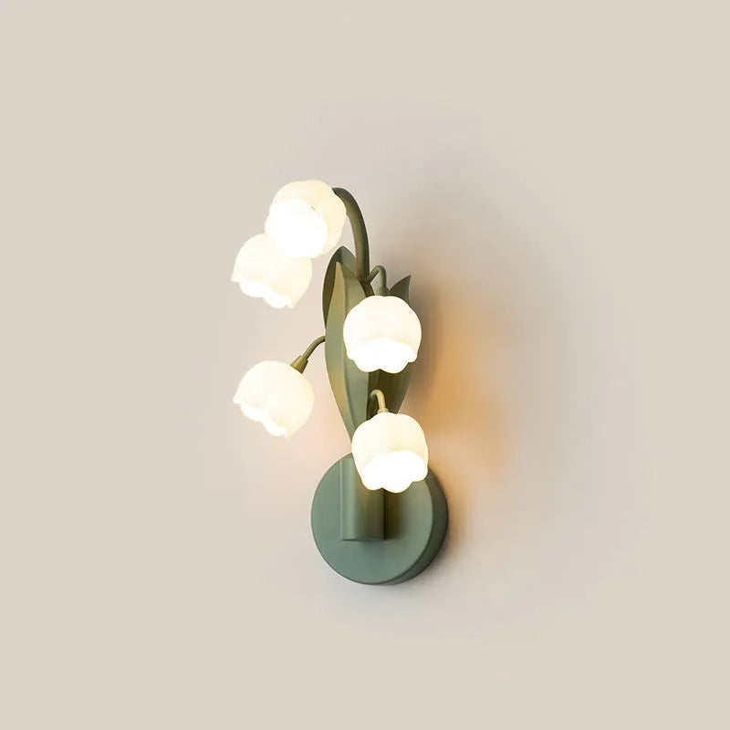 Modern minimalist French pastoral wall lamp with a green tricolour light and white PC shade mounted on a bedroom wall.