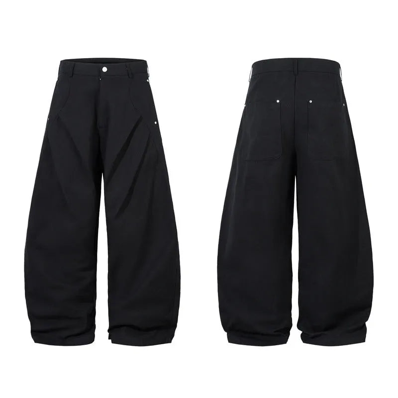 Men's black pleated casual trousers with wide-leg loose fit and machete pleat detailing