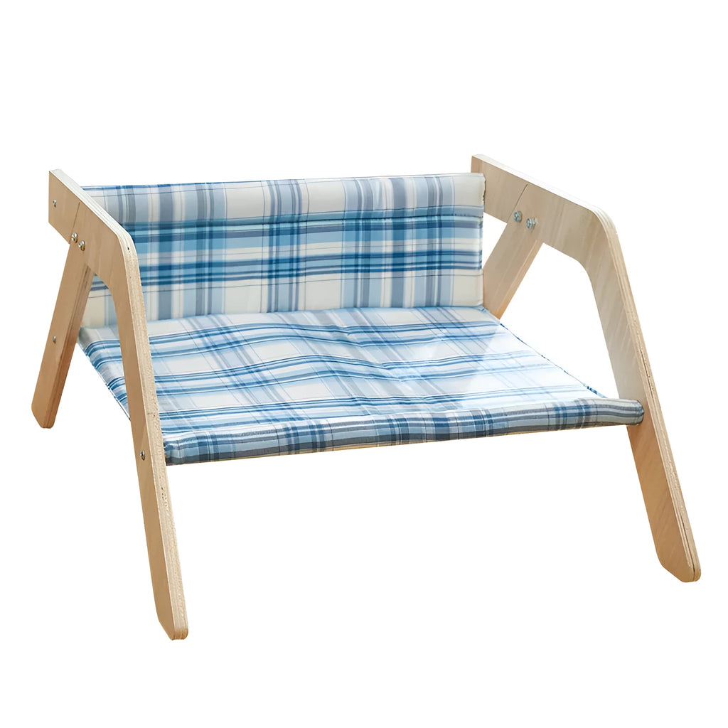 Wooden A-frame cat hammock bed with blue cloth, elevated off the floor on a carpet.