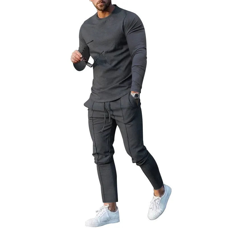 Men's light grey two-piece casual suit with long sleeve T-shirt and trousers on a hanger.