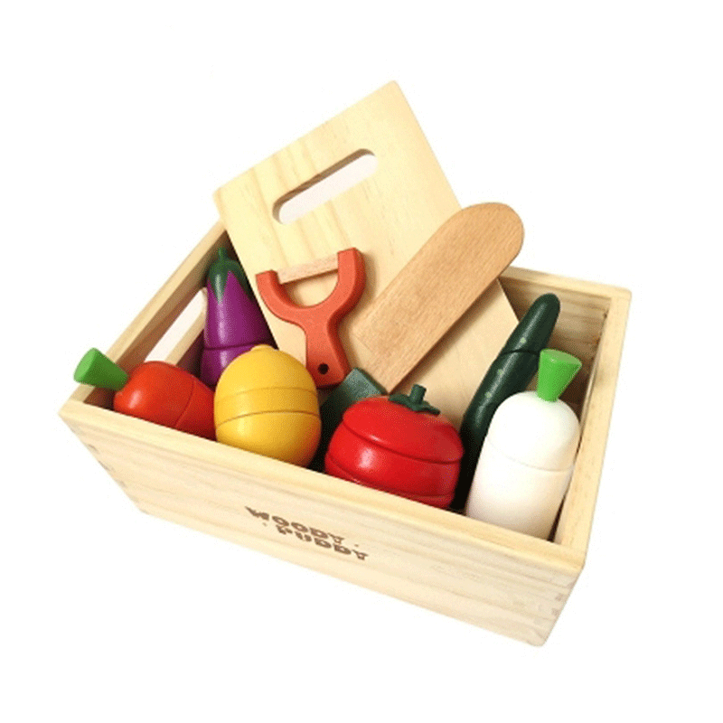 Children's wooden magnetic fruit and vegetable slicer toy on a table