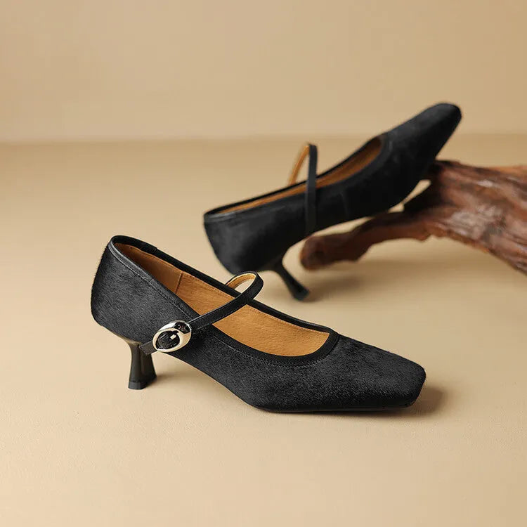 Women's black square toe stiletto ankle-strap shoes with a horse hair upper and buckle fastening.