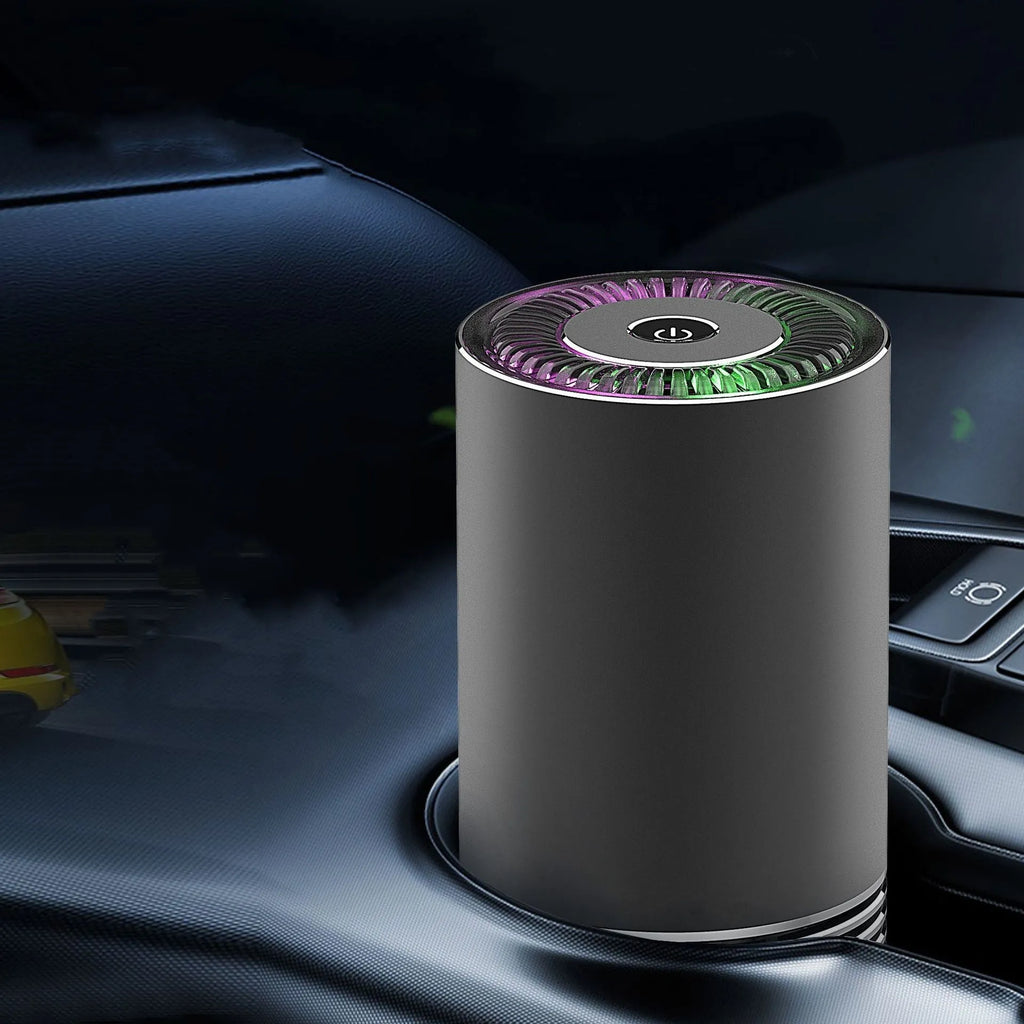 Compact aluminium alloy car air purifier in black, silver, or metallic grey for dashboard use.