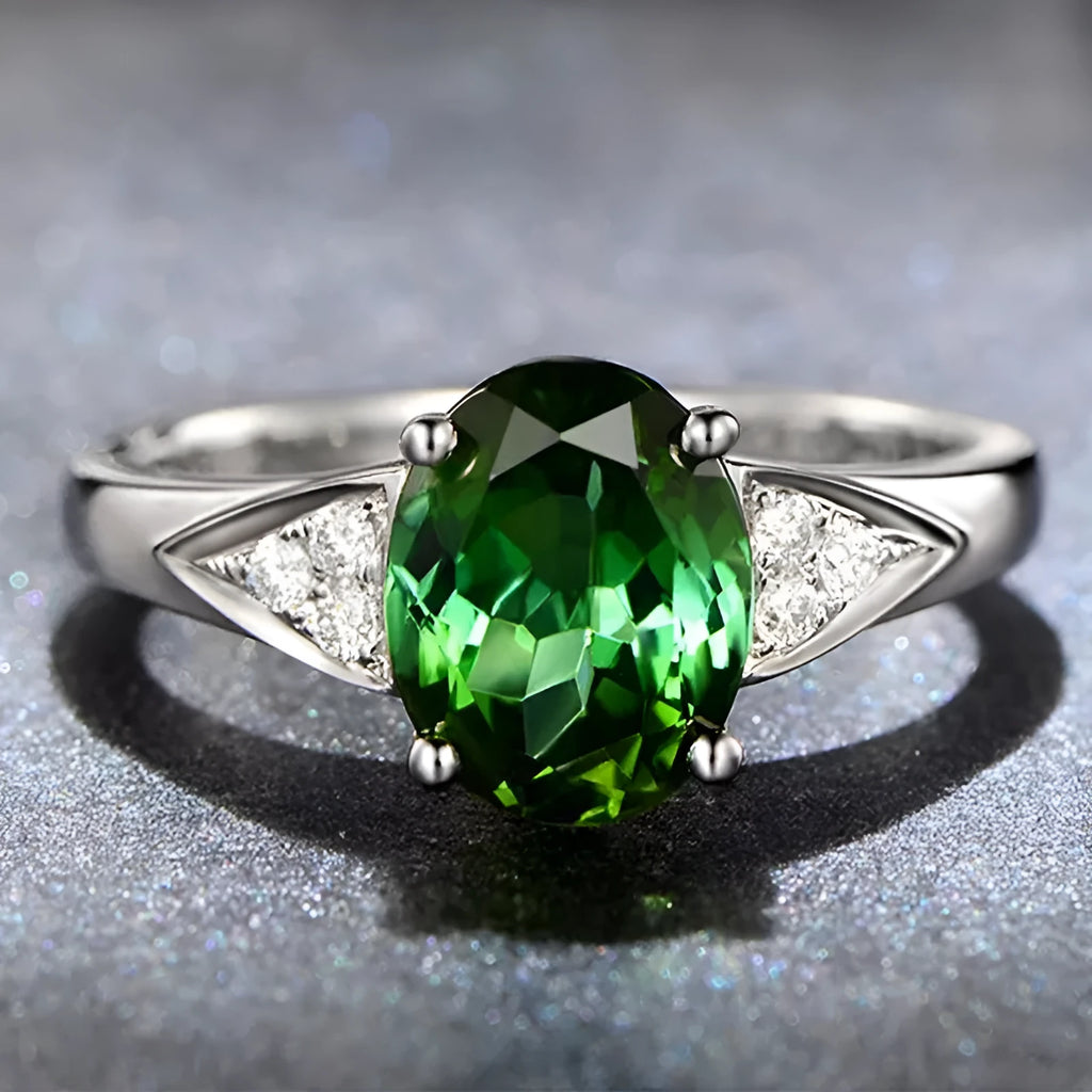 A blue zircon ring with an inlaid heart pattern on a court-style band for women.