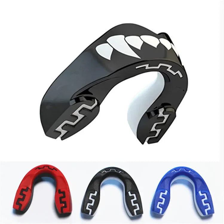 Adult boxing mouthguard with printed tooth design in black and white, for martial arts and fight sports.