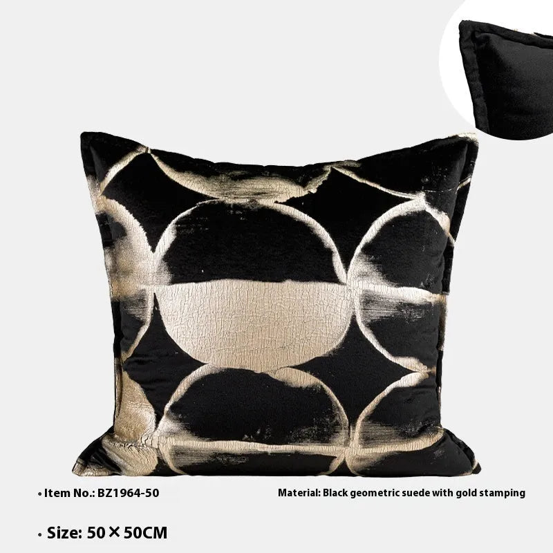 Black and gold abstract pattern cushion with flannel cover on a grey sofa