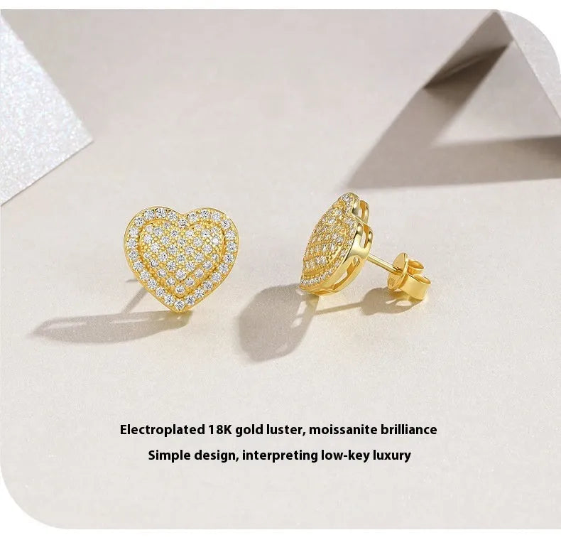 S925 sterling silver heart-shaped stud earrings with golden finish and minimalist design