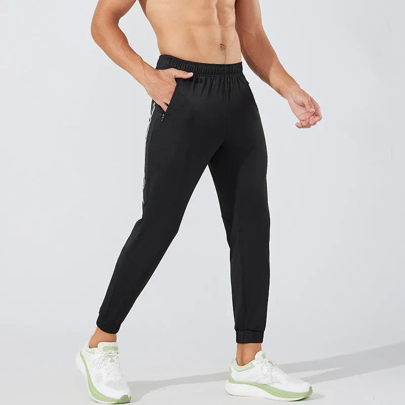 Men's black polyester running trousers with mid waist design for exercise