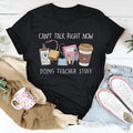 Black loose fit cotton t-shirt with short sleeves and a round neck on a hanger