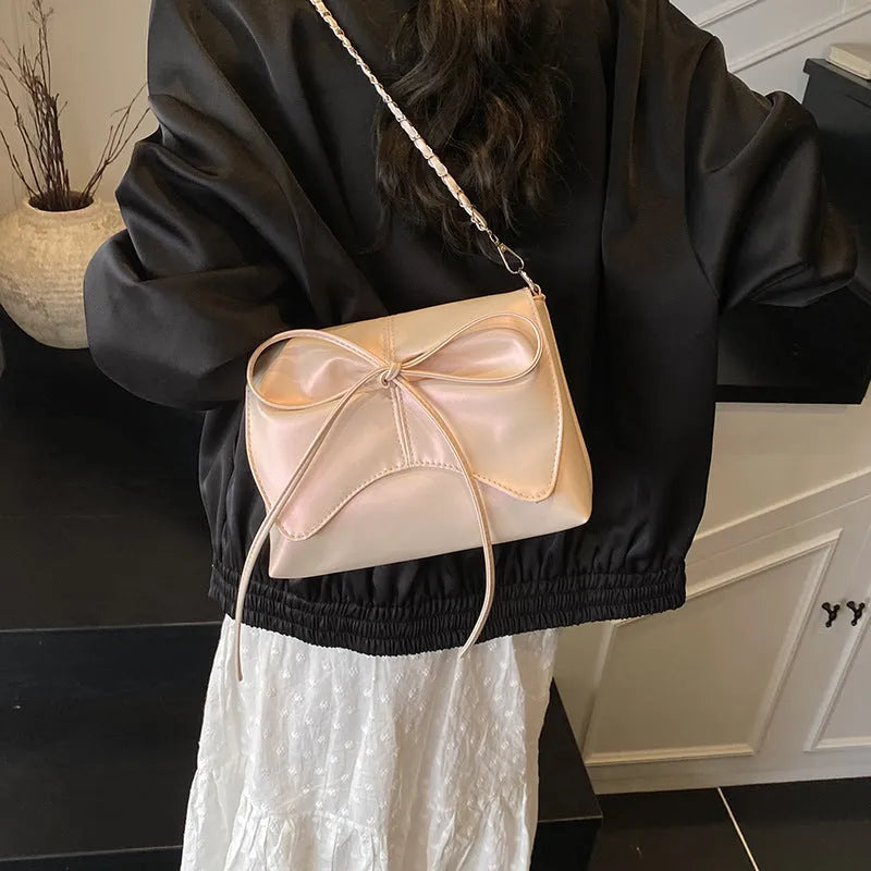 Women's black PU leather crossbody bag with square shape and sewing line detailing