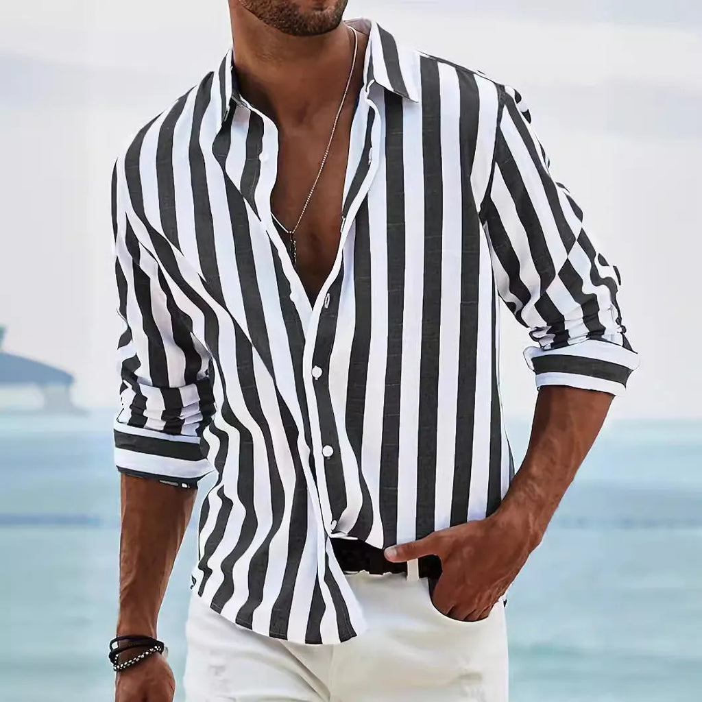 Man wearing a loose grey striped long-sleeved casual shirt with a cardigan style.