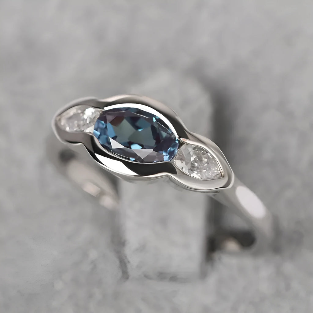 Geometric ellipse zircon ring in white gold finish on a copper band.