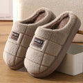 Men's plaid rabbit hair slippers with thick EVA sole and artificial wool lining in brown colour.
