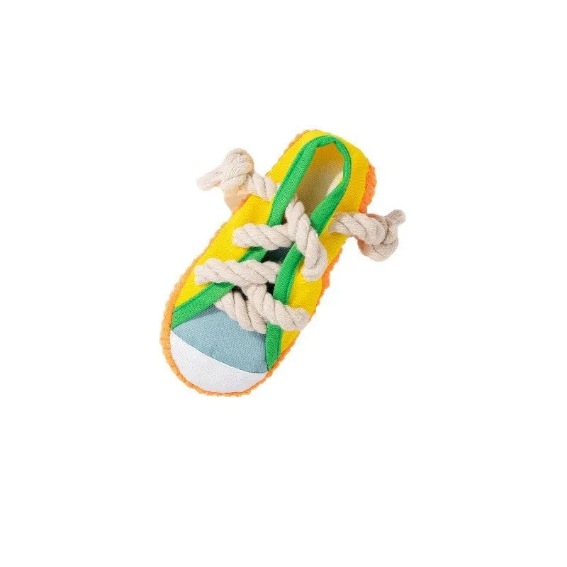 Squeaker dog chew toy shaped like slippers in plastic with bends for dental cleaning