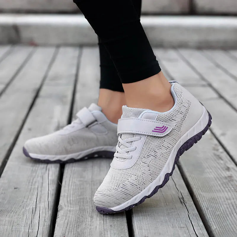 Women's low-top casual shoes with wedge heel, mesh upper, and Velcro closure in solid colours