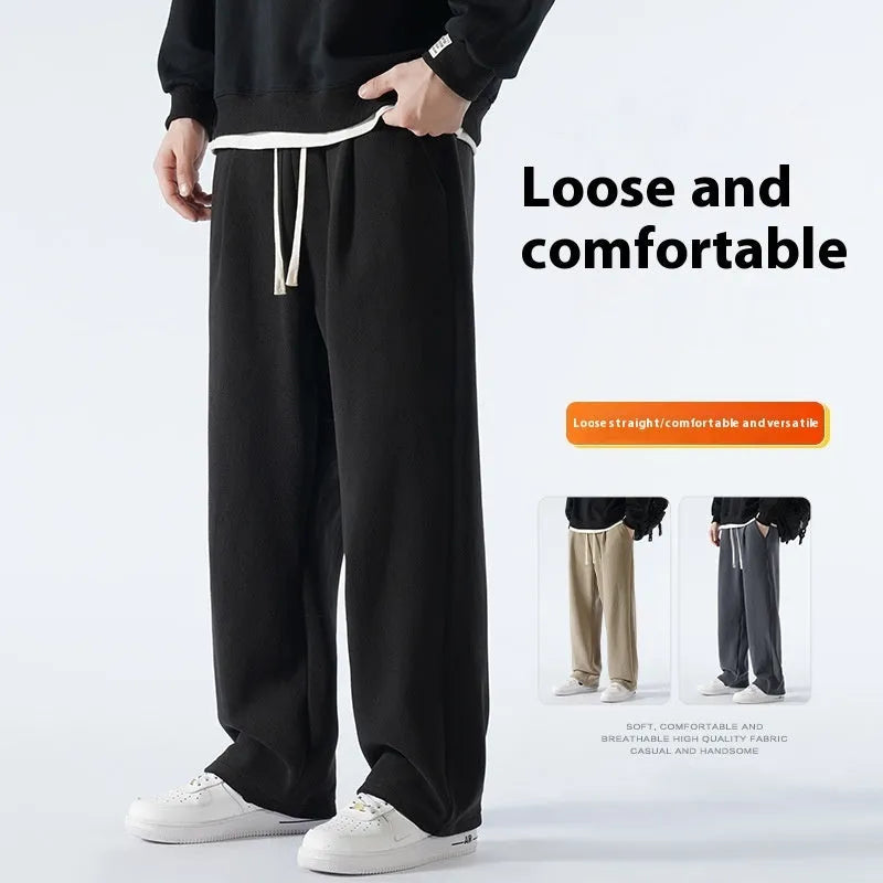 Men's apricot coloured loose-fit fleece-lined winter sports trousers with a drawstring waist laid flat.