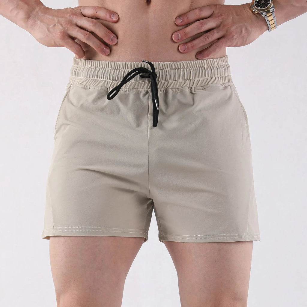 Men's thin polyester basketball shorts in grey, shown in a sports setting.