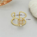 Adjustable open ring with 14K copper-plated gold finish and asymmetric U-shaped design