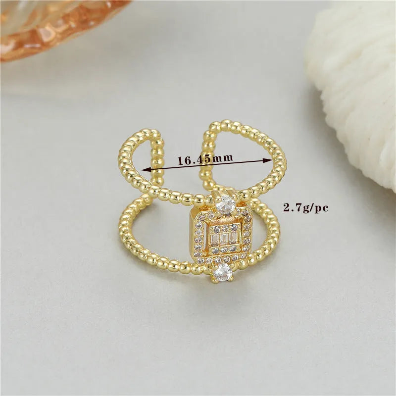 Adjustable open ring with 14K copper-plated gold finish and asymmetric U-shaped design