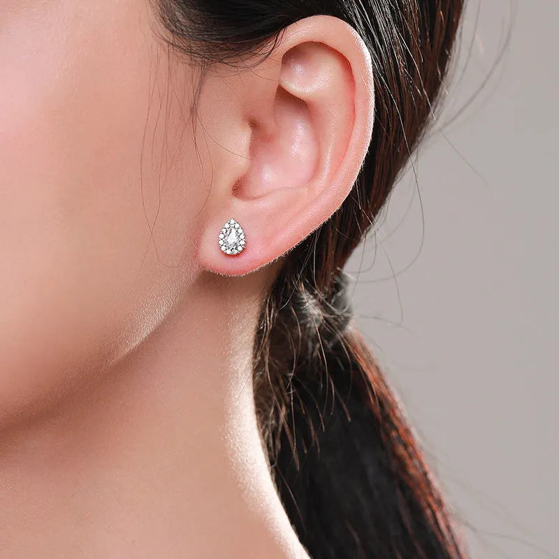 Women's silver water drop ear studs in 925 sterling silver with diamond treatment