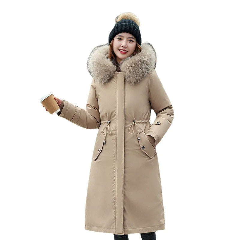 Women's long beige trench coat with fleece lining and a two-way zip front closure.