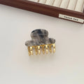 Women's retro acetate hair barrette with metal grip in leopard print pattern