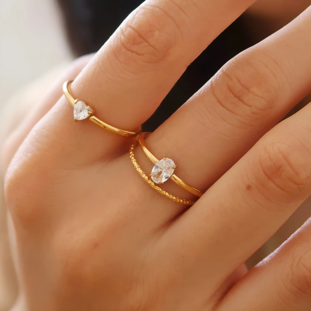 Golden love oval ring in stainless steel with electroplated finish showing heart design
