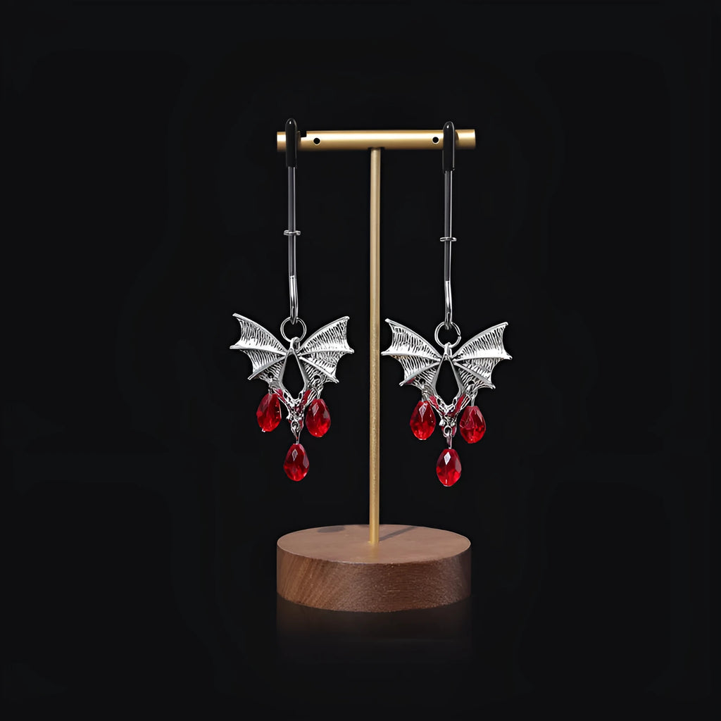 Silver alloy bat nipple clamp with red ruby bat clip decoration.