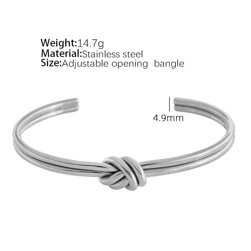 Gold or silver adjustable stainless steel women's bracelet with a C-shaped open design and double-layer knots.
