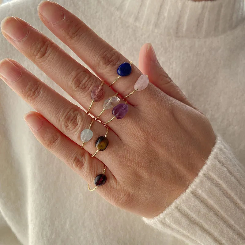 Geometric-shaped agate stone ring for women in various colour options on a neutral background.