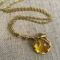 Hand-carved dragonfly pendant necklace in yellow bronze finish on a 925 silver chain.