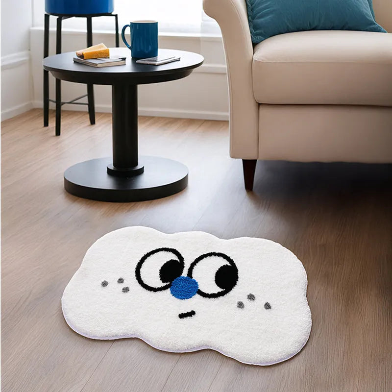 Cartoon anime Big Eye Clouds design bathroom mat in soft green colour on a bathroom floor.