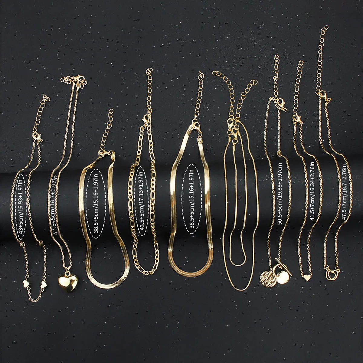 10-piece women's jewellery set with gold necklace featuring alloy pendant on snake bones chain