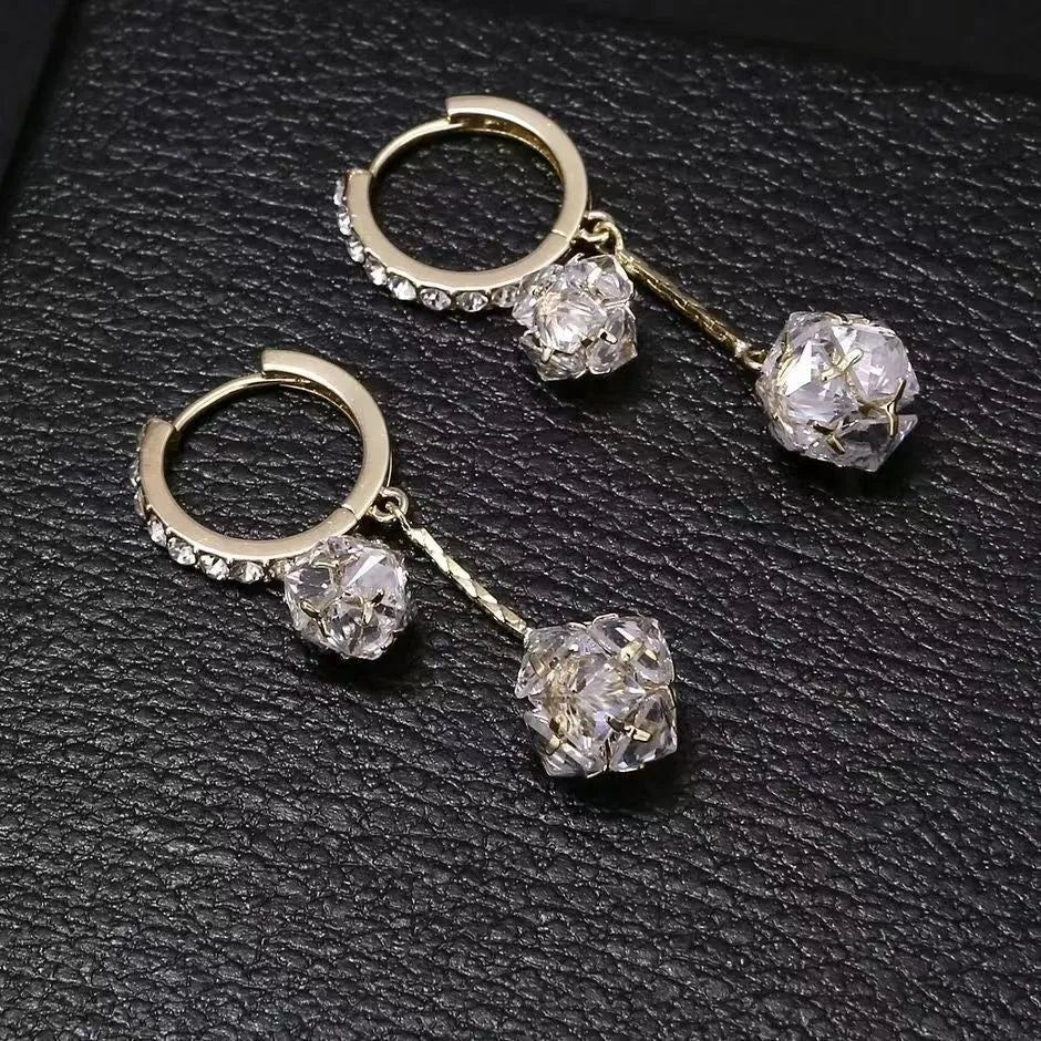 Silver drop earrings with a rhinestone ball and colourful balloon tassel pendant.