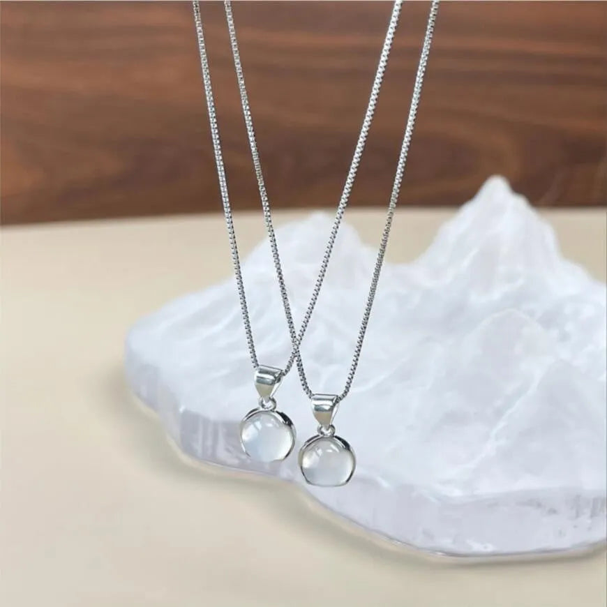 Women's oval pendant necklace with artificial crystal and eight-point star on adjustable silver-toned chain