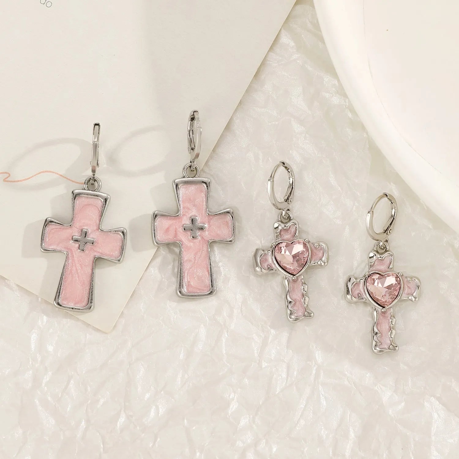 Women's alloy earrings with cross crystal design in five colour options including white, black cat, and antique silver