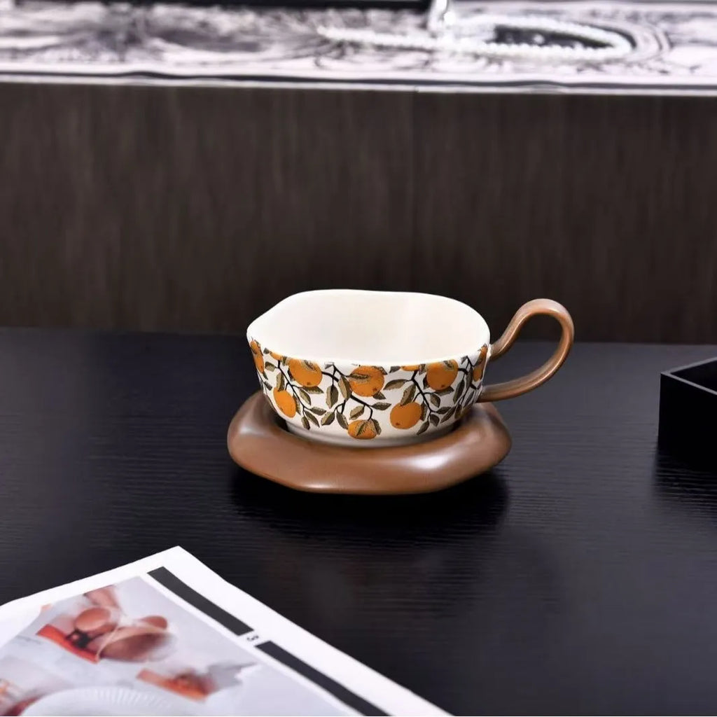 Antique-style ceramic coffee cup and saucer set in black or orange with 210ml capacity