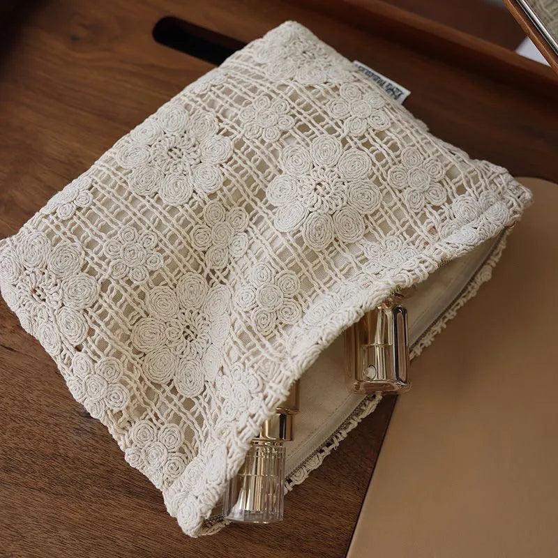 Handmade corduroy cosmetic bag with crocheted hollow flower embroidery