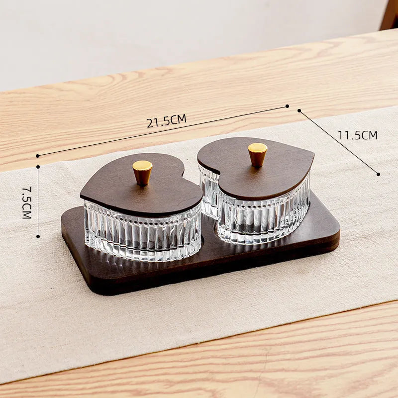 Glass fruit platter with transparent heart-shaped lids in compartmentalised serving tray