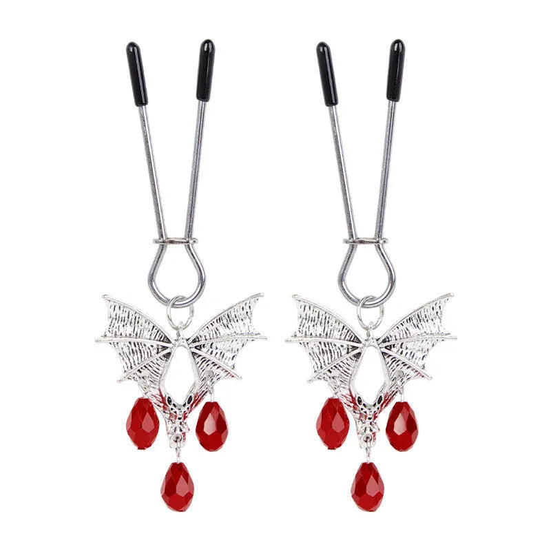 Silver alloy bat nipple clamp with red ruby bat clip decoration.