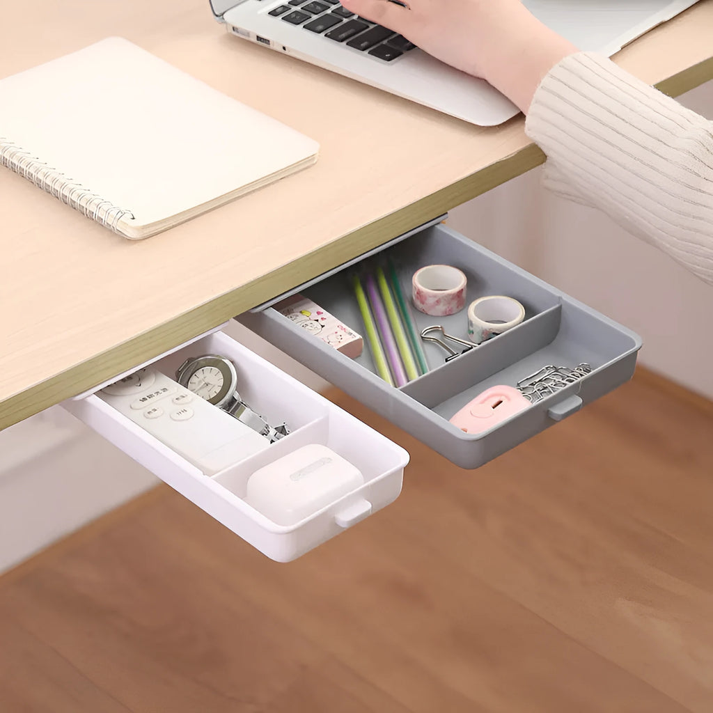 Small white plastic storage box with a lid and grid interior, mounted under a wooden table.