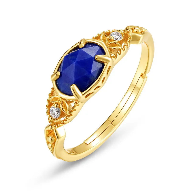 Geometric silver women's ring with a blue oval lapis lazuli gemstone.